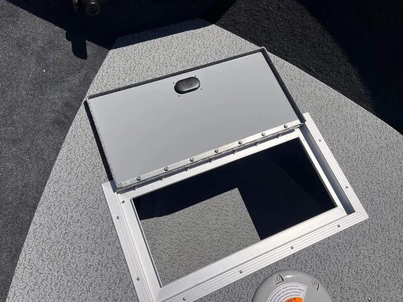 Slide: The Image of Starweld Fusion Pro 18 DC 2026 boat hatch open. - 3