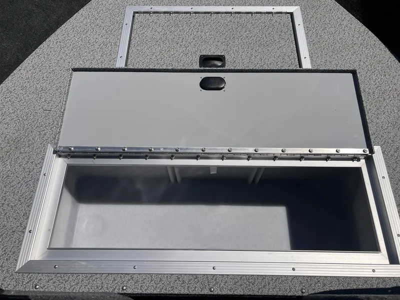 Slide: The Image of Starweld Fusion Pro 18 DC 2026 boat hatch, open, gray surface. - 6