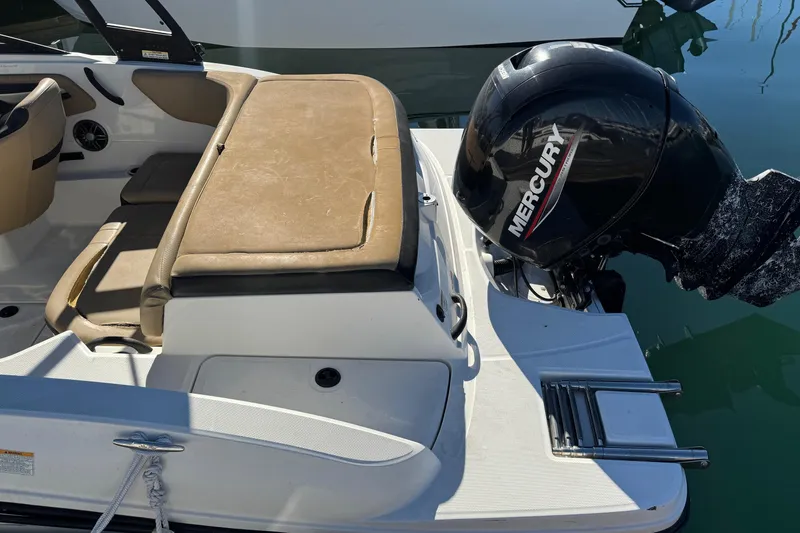 Slide: The Image of 2022 Sea Ray SPX 190 Outboard with Mercury engine, featuring tan seating and swim platform. - 15