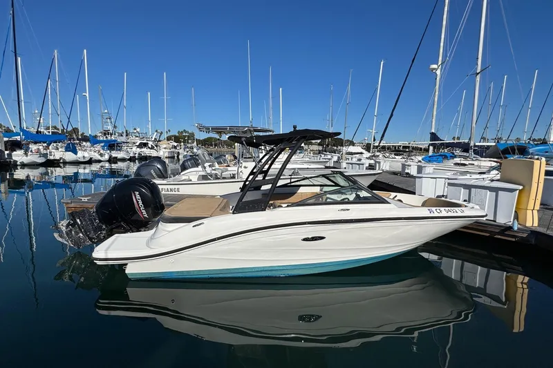 Slide: The Image of 2022 Sea Ray SPX 190 Outboard boat docked in a marina under clear blue skies. - 5