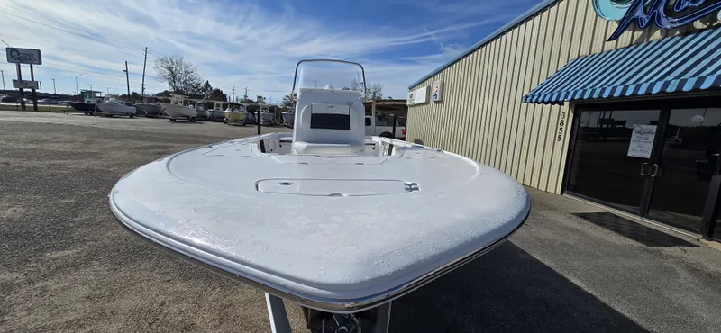 Slide: The Image of 2026 Tidewater 2110BMT boat parked in front of a building. - 9