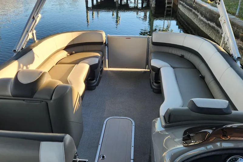 Slide: The Image of Luxurious 2022 Tahoe Tritune 2585 ENT boat interior with plush seating and elegant design. - 12
