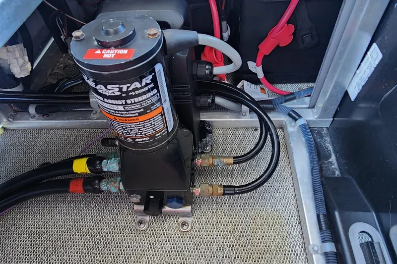 Slide: The Image of 2022 Tahoe Tritune 2585 ENT hydraulic steering system with cables and connections. - 31