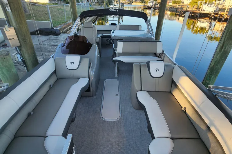 Slide: The Image of 2022 Tahoe Tritune 2585 ENT pontoon boat interior with spacious seating and elegant design. - 43