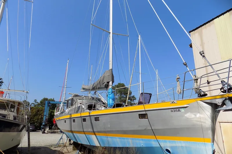 Slide: The Image of Sailboats docked in a marina, featuring a 2014 Custom Aluminum Expedition. - 0