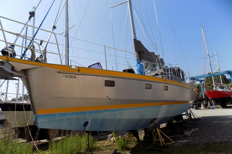 Slide: The Image of Custom Aluminum Expedition yacht, 2014 model, docked in a marina under clear blue skies. - 1