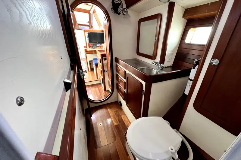 Slide: The Image of Interior of 2014 Custom Aluminum Expedition boat with wooden accents and cozy sleeping area. - 14