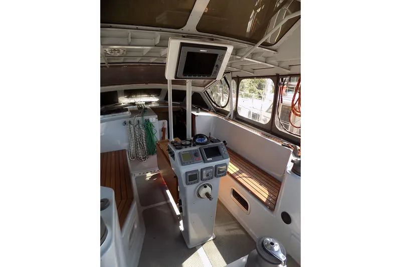 Slide: The Image of Interior of 2014 Custom Aluminum Expedition yacht with wood paneling and navigation equipment. - 17