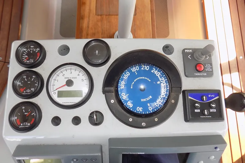 Slide: The Image of Control panel of a 2014 Custom Aluminum Expedition boat with gauges and compass. - 25