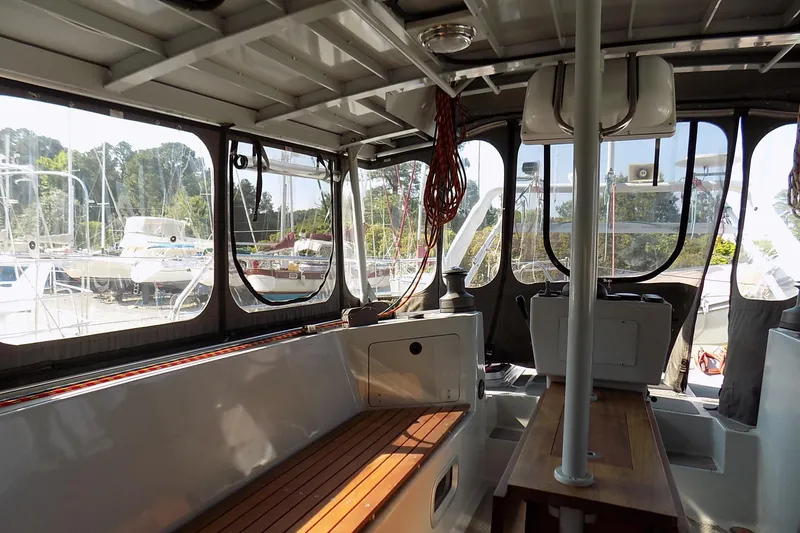 Slide: The Image of Interior of 2014 Custom Aluminum Expedition boat with wooden seating and large windows. - 29