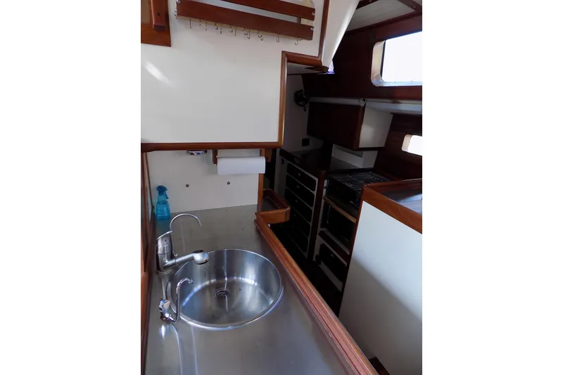 Slide: The Image of Interior of 2014 Custom Aluminum Expedition boat with stainless steel sink and wooden accents. - 30