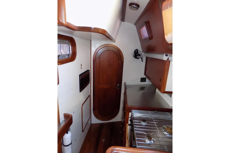Slide: The Image of Interior of 2014 Custom Aluminum Expedition yacht with wood accents and compact kitchen area. - 32