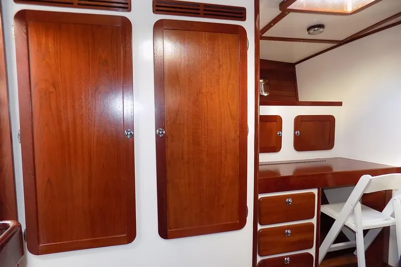 Slide: The Image of Interior of 2014 Custom Aluminum Expedition with wooden cabinets and desk. - 39
