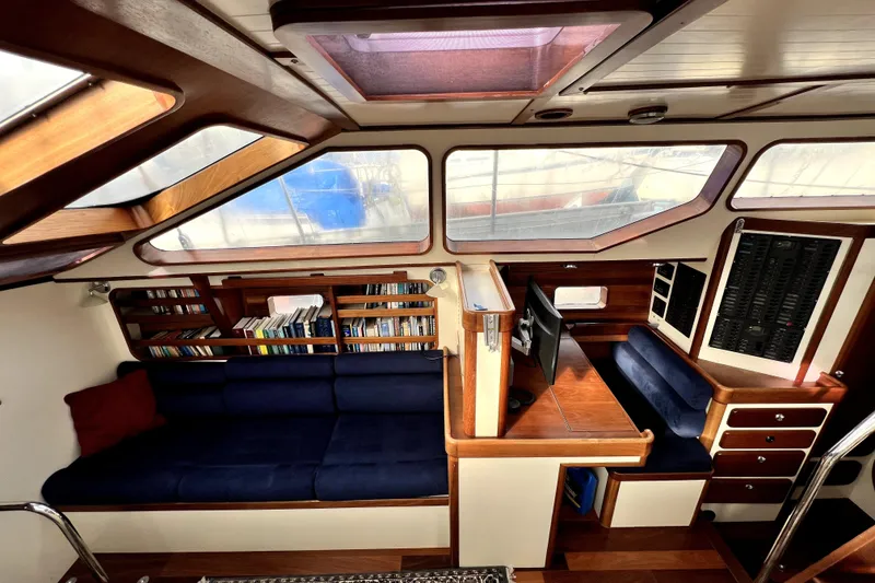Slide: The Image of Custom 2014 Aluminum Expedition sailboat on dry dock, featuring a sleek design and vibrant colors. - 4