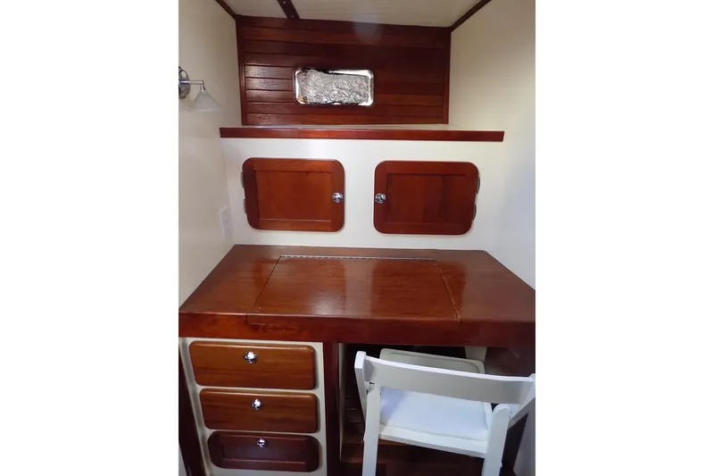 Slide: The Image of Wooden desk and storage in 2014 Custom Aluminum Expedition boat interior. - 40