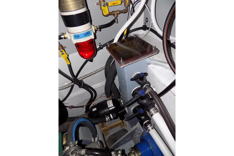 Slide: The Image of Engine room of 2014 Custom Aluminum Expedition with fuel filter and plumbing components. - 47