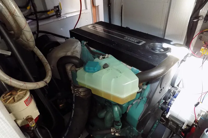 Slide: The Image of Engine compartment of a 2014 Custom Aluminum Expedition boat, showcasing detailed components. - 48