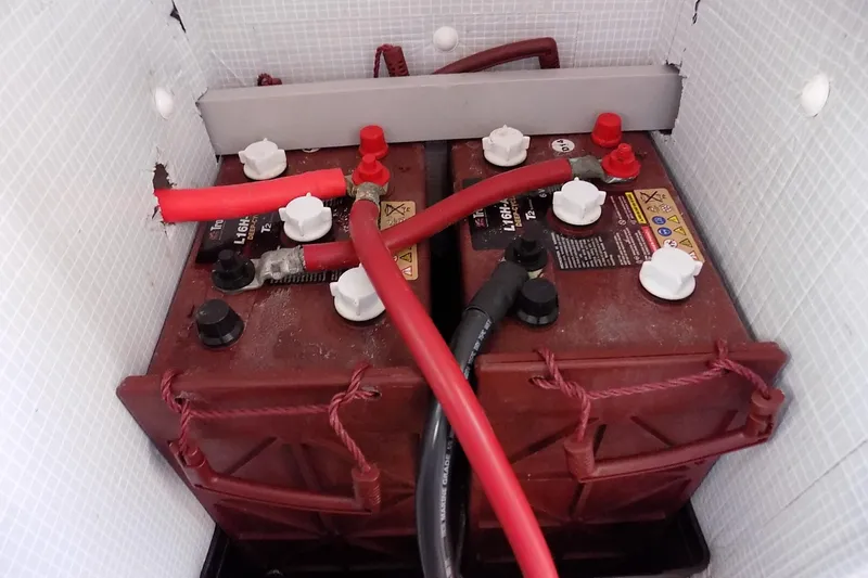 Slide: The Image of Red and black cables connected to dual batteries in a Custom Aluminum Expedition 2014. - 50