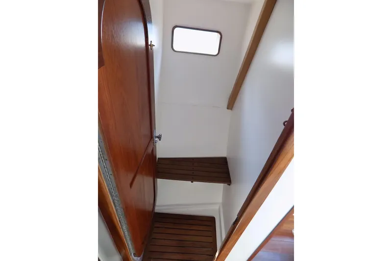 Slide: The Image of Interior of 2014 Custom Aluminum Expedition boat with wooden steps and door. - 51