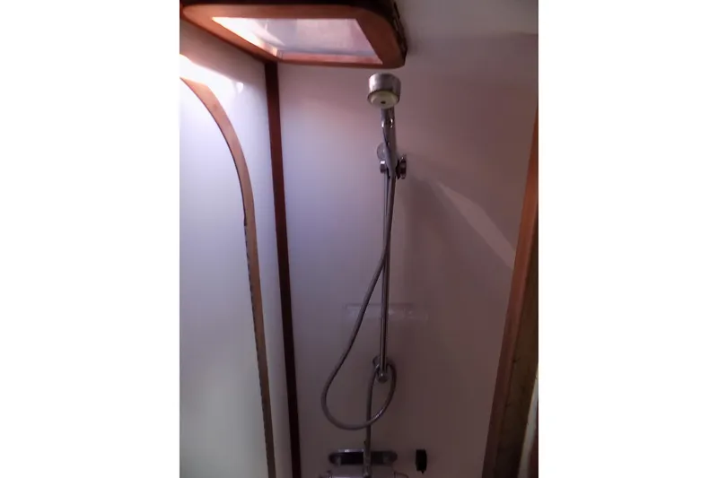 Slide: The Image of Shower area in 2014 Custom Aluminum Expedition boat, featuring a handheld showerhead. - 52