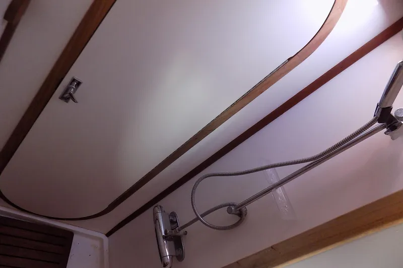 Slide: The Image of Shower area in 2014 Custom Aluminum Expedition boat with wooden trim. - 53