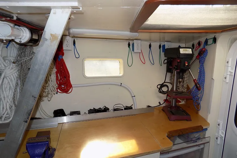 Slide: The Image of Workshop interior of 2014 Custom Aluminum Expedition with tools and ropes organized neatly. - 54