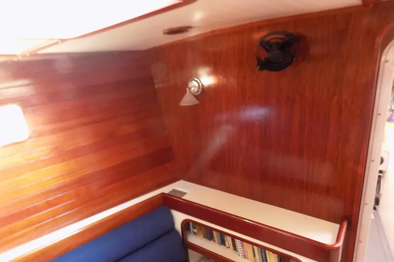 Slide: The Image of Cozy wooden interior of 2014 Custom Aluminum Expedition yacht with bookshelf and lighting. - 57