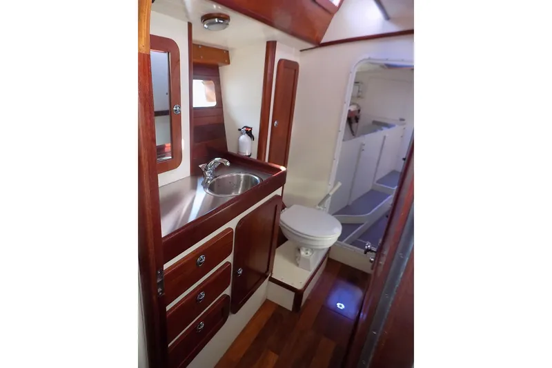 Slide: The Image of Luxurious 2014 Custom Aluminum Expedition yacht bathroom with wood accents and modern fixtures. - 61