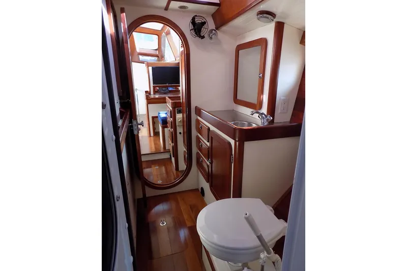 Slide: The Image of Interior of 2014 Custom Aluminum Expedition yacht with wooden cabinetry and compact bathroom. - 62