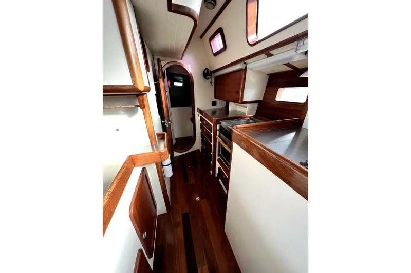 Slide: The Image of Interior of 2014 Custom Aluminum Expedition yacht with blue seating and wooden accents. - 9