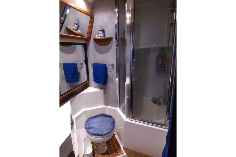 Slide: The Image of Bathroom interior of 1991 Bayliner 4588 Pilothouse with shower and toilet. - 16