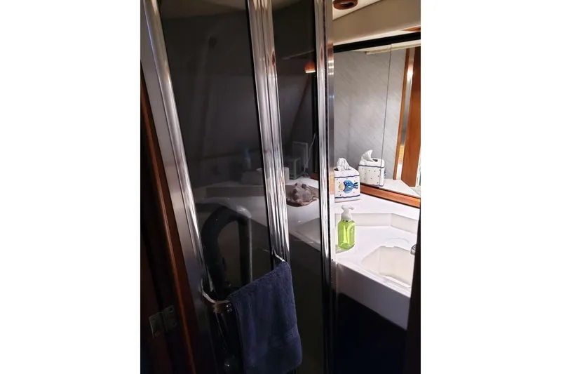 Slide: The Image of Bathroom interior of 1991 Bayliner 4588 Pilothouse yacht with shower and sink. - 20