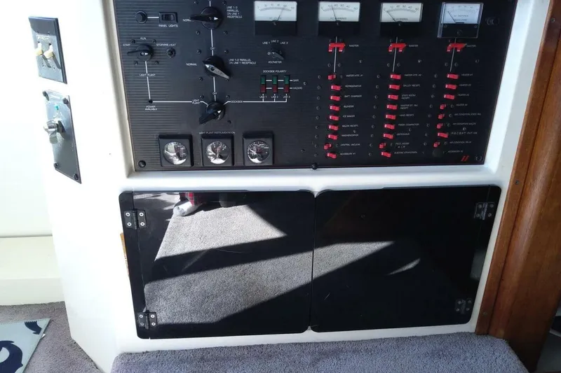Slide: The Image of Control panel of a 1991 Bayliner 4588 Pilothouse yacht with switches and gauges. - 25