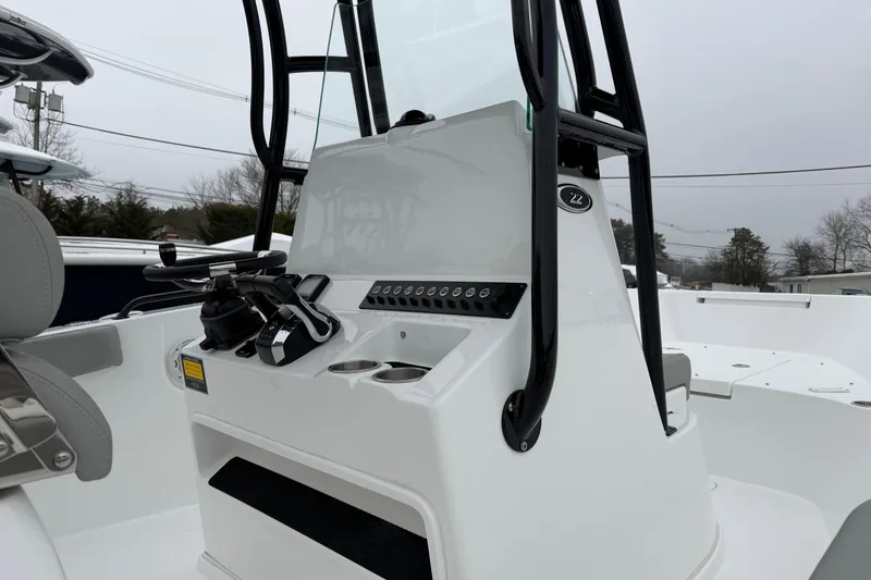 Slide: The Image of 2026 Cape Horn 22 OS boat console with steering wheel and controls. - 12