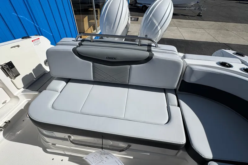 Slide: The Image of 2026 Chaparral 280 OSX boat interior with sleek white seating and modern design. - 13