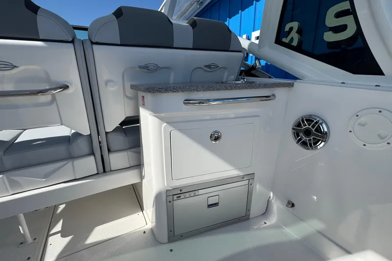 Slide: The Image of Interior view of 2026 Chaparral 280 OSX boat, featuring sleek seating and modern amenities. - 15