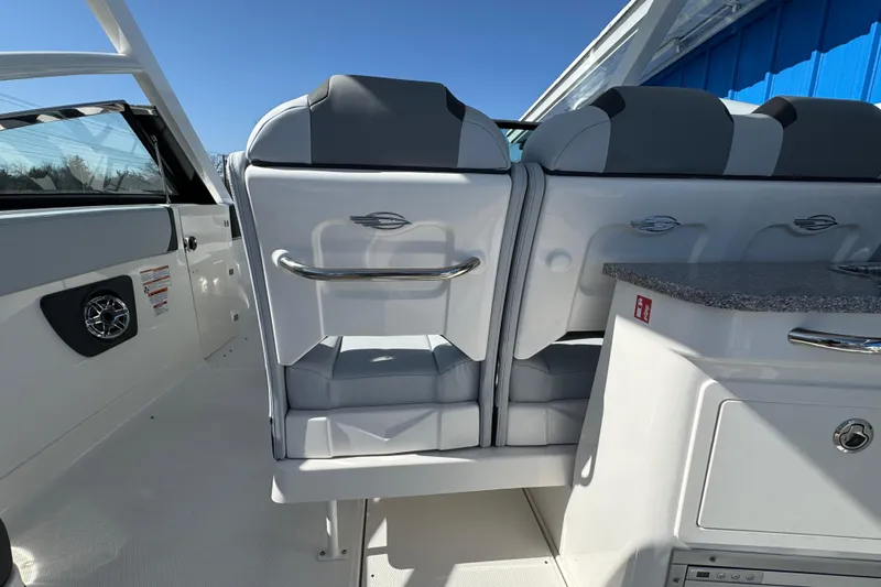 Slide: The Image of 2026 Chaparral 280 OSX boat interior with sleek seating and modern design features. - 16