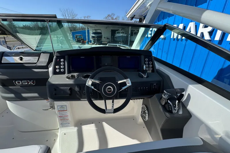 Slide: The Image of Cockpit of 2026 Chaparral 280 OSX boat with modern steering and controls. - 17