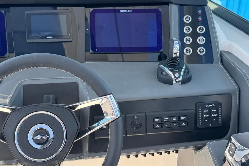 Slide: The Image of Steering console of 2026 Chaparral 280 OSX with advanced navigation and control systems. - 19