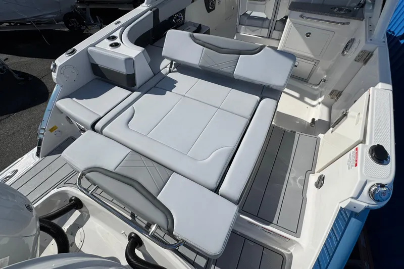 Slide: The Image of 2026 Chaparral 280 OSX boat interior with sleek seating and modern design. - 24