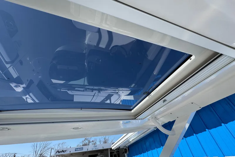 Slide: The Image of 2026 Chaparral 280 OSX boat with a sleek, modern sunroof design. - 29