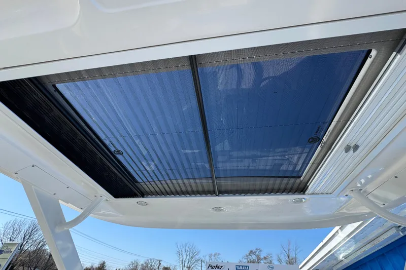 Slide: The Image of Rooftop view of 2026 Chaparral 280 OSX boat with retractable sunroof. - 31