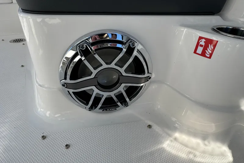 Slide: The Image of JL Audio speaker on 2026 Chaparral 280 OSX boat, with fire extinguisher symbol nearby. - 34