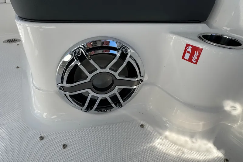Slide: The Image of Speaker and fire extinguisher symbol on 2026 Chaparral 280 OSX boat interior. - 35