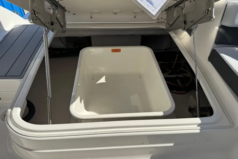 Slide: The Image of Open storage compartment on 2026 Chaparral 280 OSX boat, showcasing interior space. - 36