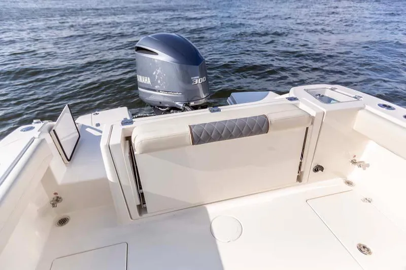Slide: The Image of Manufacturer Provided Image: 2026 Cobia 240 Dual Console boat with Yamaha 300 engine on water. - 13