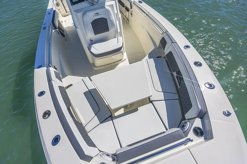 Slide: The Image of Manufacturer Provided Image: 2025 Cobia 265 Center Console boat with spacious seating on calm water. - 9