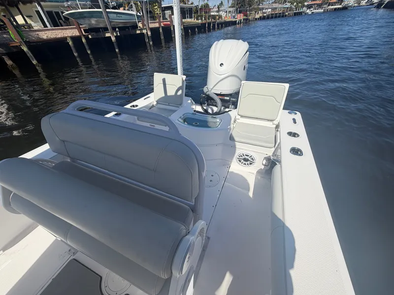 Slide: The Image of 2023 Everglades 243 Center Console boat on calm water. - 11