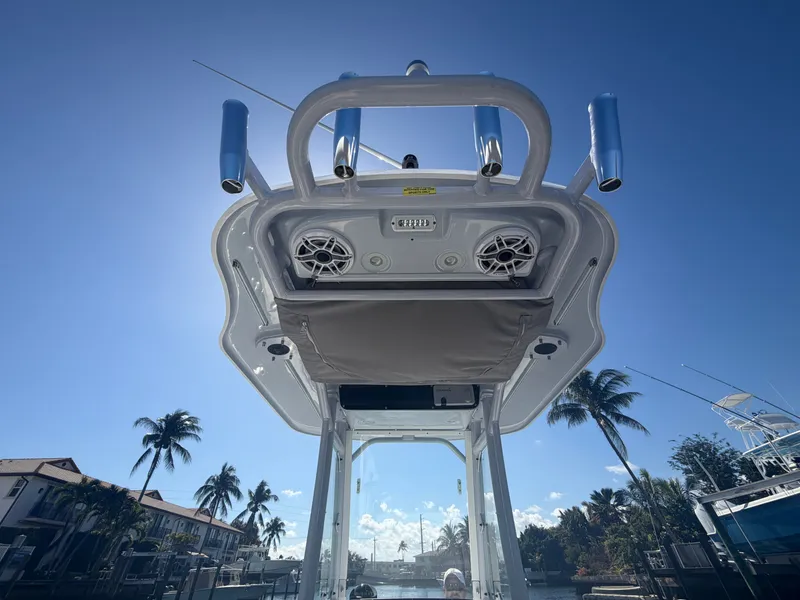 Slide: The Image of Everglades 243 Center Console 2023 with speakers and blue sky. - 12