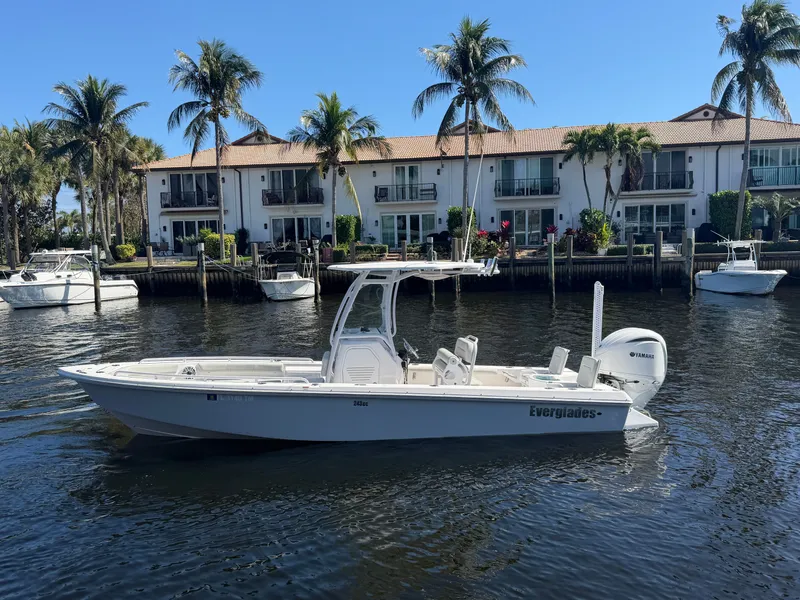 Slide: The Image of 2023 Everglades 243 Center Console near waterfront homes. - 5